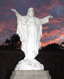 Sacred Heart statue at sunset